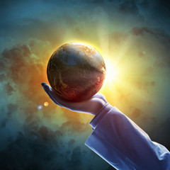 Wall Mural - image of earth planet on hand