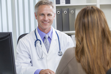 Male Hospital Doctor Talking to Female Patient