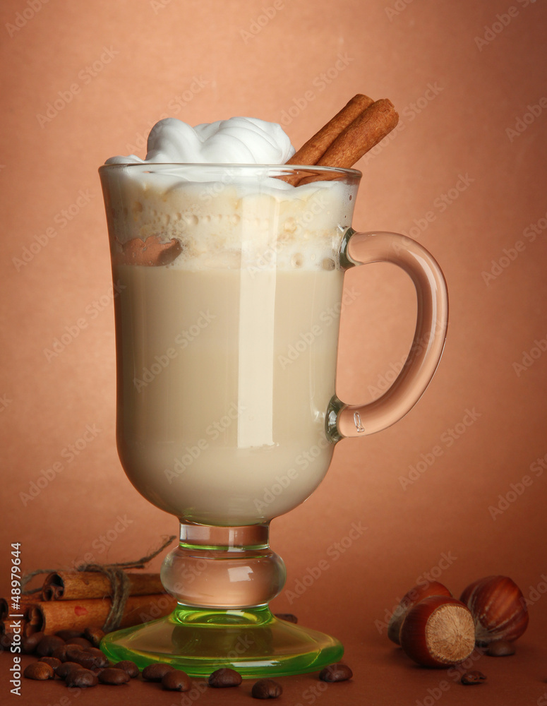 Fragrant coffee latte in glass cup with spices,