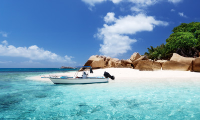 Wall Mural - speed boat on the beach of Coco Island, Seychelles