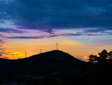 Sunset Mountain With Electric Windmills