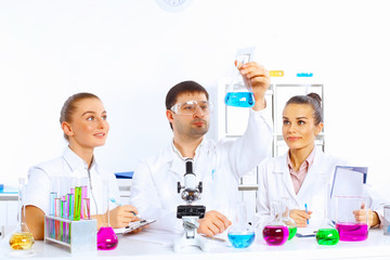 Wall Mural - Team of scientists working in laboratory