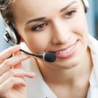 © vgstudio - Happy smiling support phone operator at office