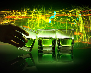 Three glasses of green absinth