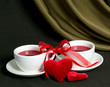 Two cups of tea and valentine hearts