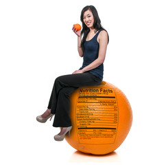 Wall Mural - Woman Sitting on Orange with Nutrition Label