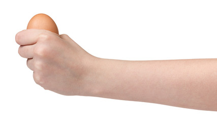 female teen hand holding egg