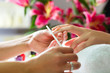 © Kzenon - Woman in nail salon receiving manicure
