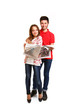 © majesticca - Portrait of attractive young couple with a newspaper isolated on