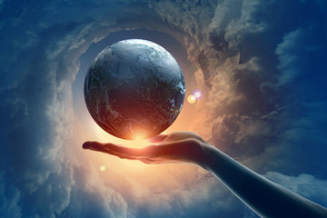 Wall Mural - image of earth planet on hand