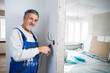 © lightpoet - Senior man working on the electrical installations