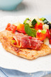 chicken fillet baked with mozzarella, Parma ham and vegetables