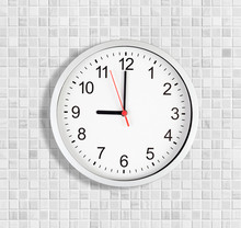 Simple Clock Or Watch On White Tile Wall Displaying Nine O'clock