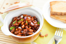 Brown Beans With Onion In A Ceramic Pot