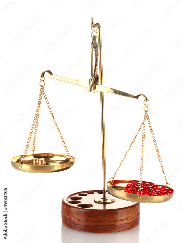 Classic scales with color pills isolated on white