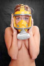 Terrified Woman In A Yellow Gas Mask.