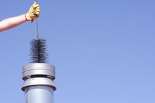 Cleaning Chimney With Sweeper Sky Background