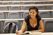 © michaeljung - female african american college student sitting in lecture hall