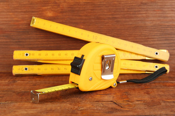 Poster - Tape measure and ruler on wooden background