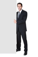 Wall Mural - Businessman presenting empty banner