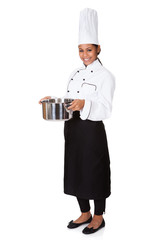 Wall Mural - Female Chef With Cooking Pot In Hand