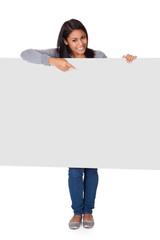 Wall Mural - Young Woman Holding Placard