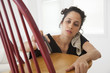 © Peter Dressel/Blend Images - Hispanic woman sanding chair