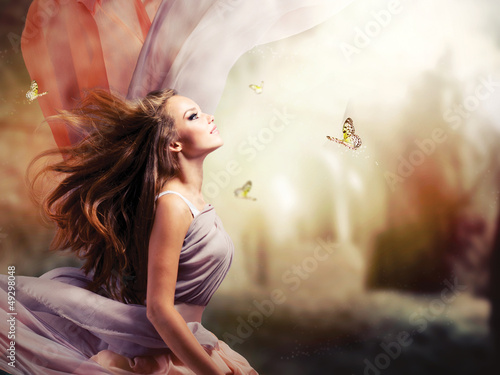 Fototapeta na wymiar Beautiful Girl in Fantasy Mystical and Magical Spring Garden