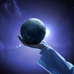 Wall Mural - image of earth planet on hand
