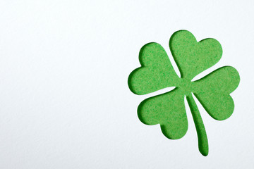 St. Patrick clover cut from paper. Greeting card. Paper craft.