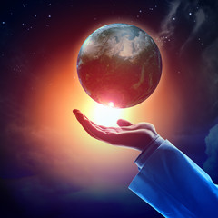 Wall Mural - image of earth planet on hand