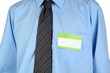 © Africa Studio - Blank nametag on businessman's blue shirt close up