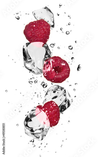 Plakat na zamówienie Raspberries with ice cubes, isolated on white background