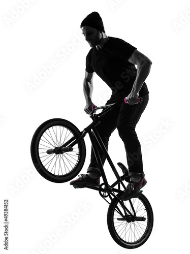 Obraz na płótnie canvas czteroczęściowy "tetraptyk" Mężczyzna sylwetka akrobatyczna bmx