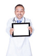 © Andrey Popov - Happy Doctor Holding Blank Digital Tablet
