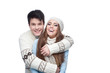© photo-nuke - young smiling couple in winter clothing embracing