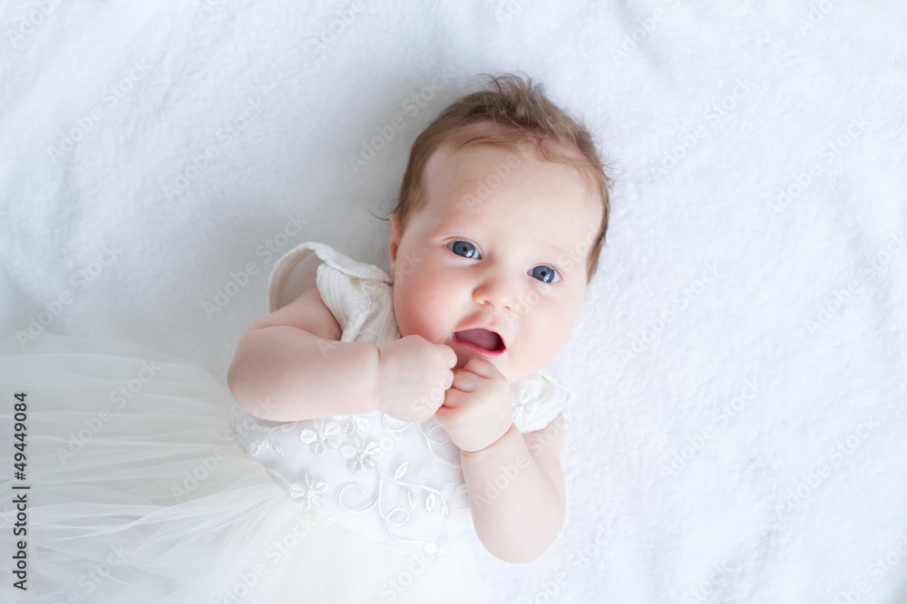 Blue eyed baby girl in a white dress - obrazy, fototapety, plakaty 