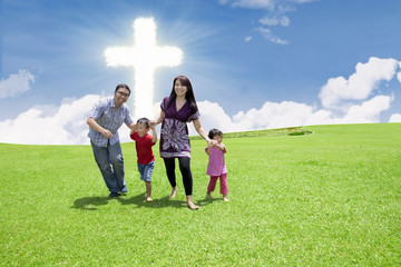 Catholic family at the Cross