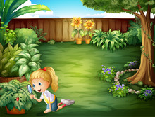 A Girl Studying The Plants In The Garden