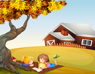 Wall Mural - Kids reading under a big tree