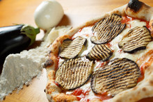 Typical Italian Pizza, Ingredients In Background On Wood Table