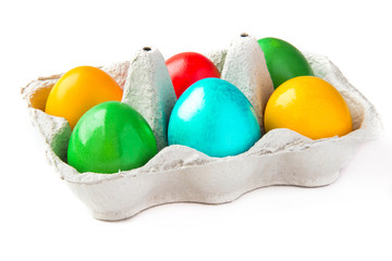 colored painted eggs in a basket