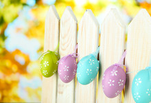 Art Easter Background With Eggs Hanging On Fence