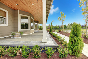 Wall Mural - Large farm country house with long covered porch.