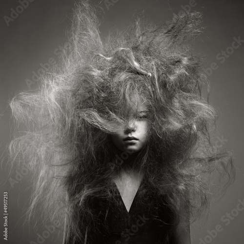 Naklejka - mata magnetyczna na lodówkę Young girl with a volume fashionable hairstyle