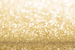 © rangizzz - Gold defocused glitter background with copy space