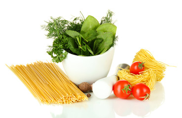 Wall Mural - Composition of mortar, pasta and green herbals, isolated