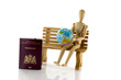 passport globe and man on bench