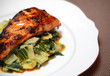 Salmon filet on bed of swiss chard and potatoes