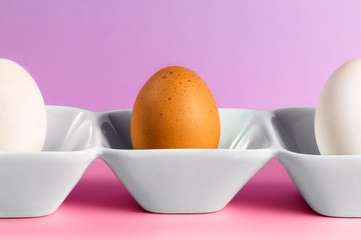 An egg and two halves standing on a dish